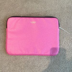 Pink Isaac mizrahi laptop sleeve. Zipper is broken so it has a zip tie
